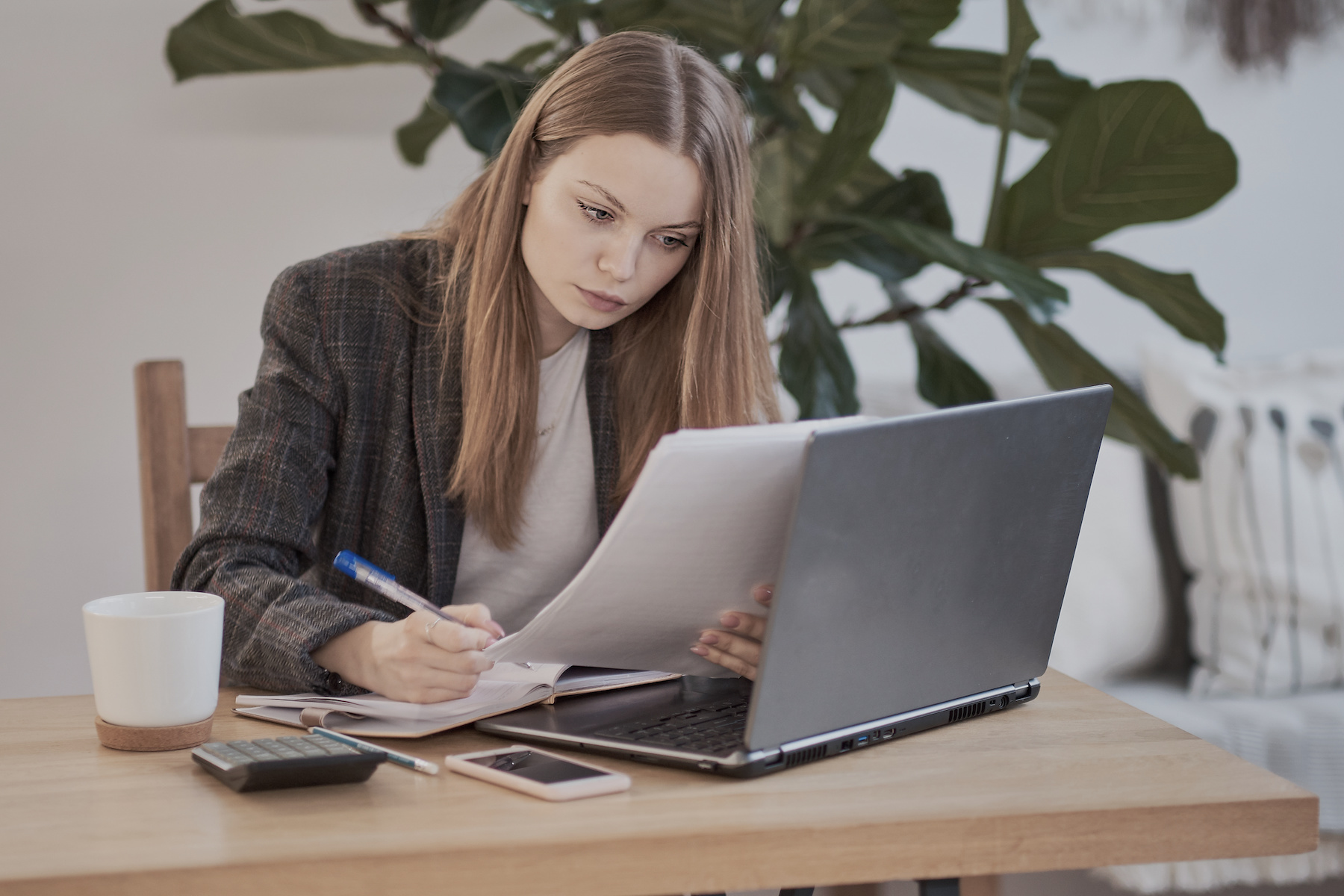 woman typing out employee handbook
