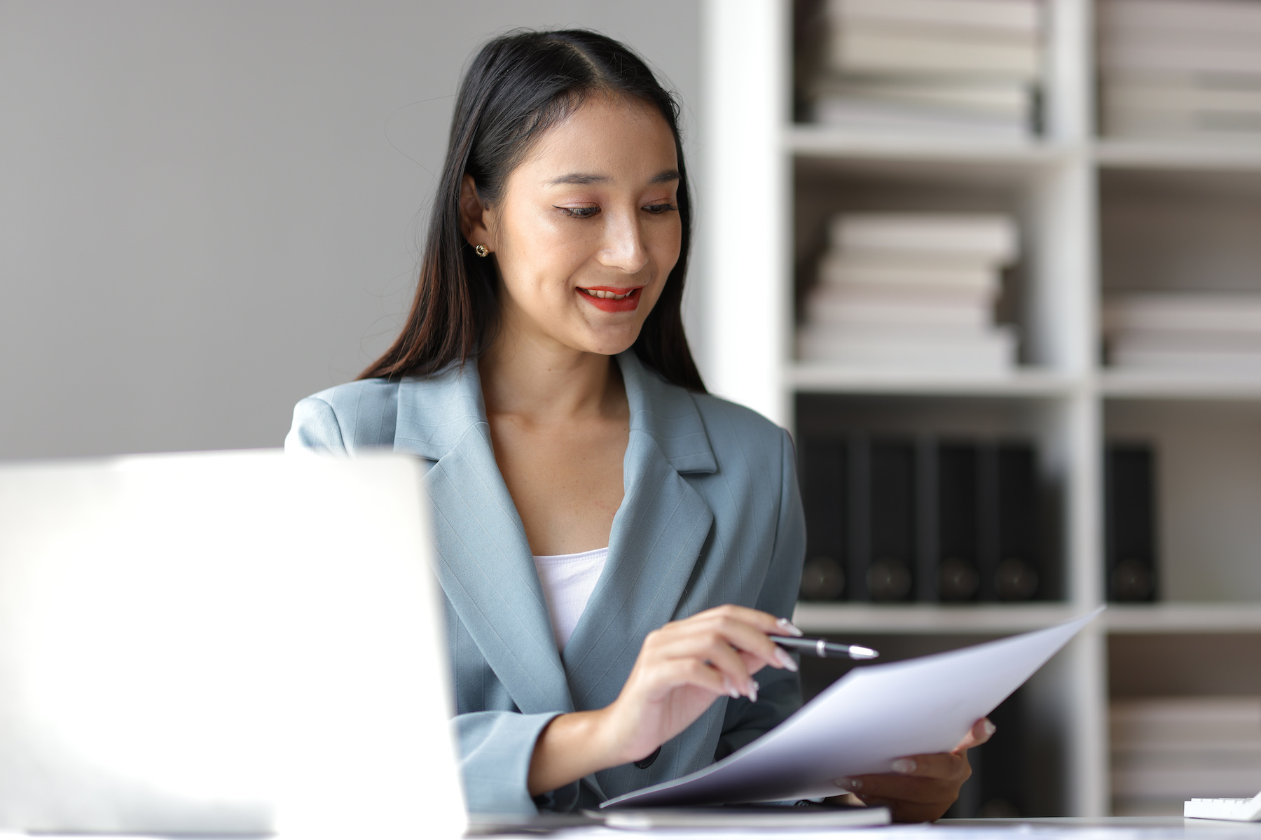 HR professional reviewing checklist
