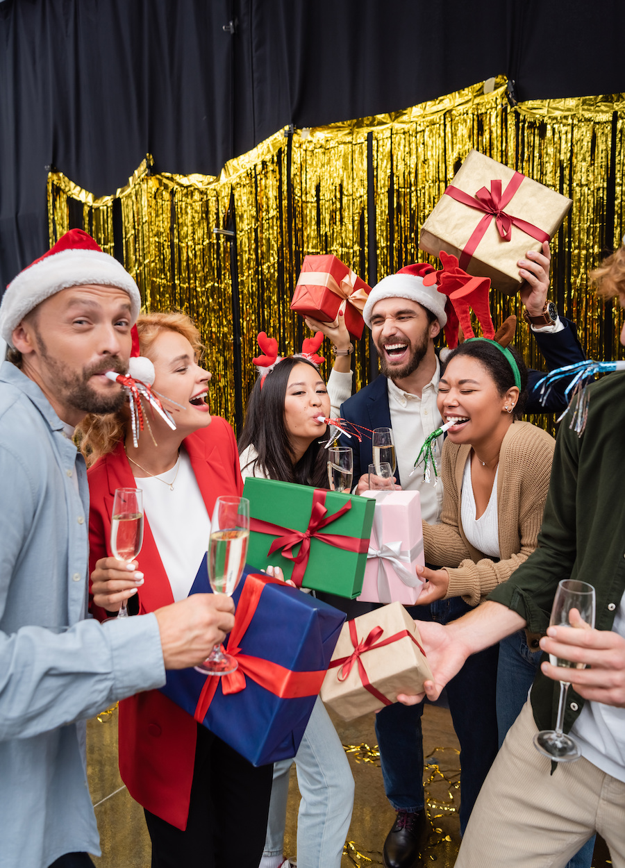 Coworkers drinking champagne at holiday party